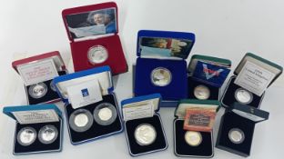 A collection of silver spoof commemorative coins, to include a Silver proof memorial crown for the