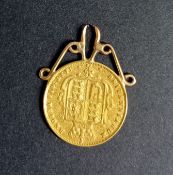 A Victoria shield back half sovereign, 1877, mounted on a pendant.