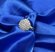 An 18ct yellow gold diamond cluster ring, approx 5.5g, size M.
