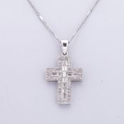 An 18ct white gold cross pendant set with a mixture of baguette cuts & round brilliant cut diamonds,