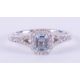 An 18ct white gold ring set with a central emerald cut aquamarine, approx. 0.50 carats, surrounded - Image 1 of 2