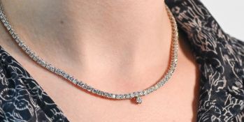 An impressive 18ct white gold diamond line necklace, approx diamond weight 10 carats.