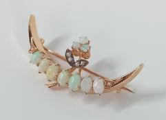 A 14ct gold opal and seed pearl crescent brooch, approx 3.49g.