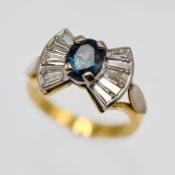 An 18k yellow gold diamond and sapphire 'bow' shape design ring, set with ten baguette cut diamonds,