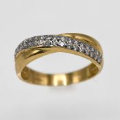 An 18ct yellow gold diamond cross over design ring, size O/P.