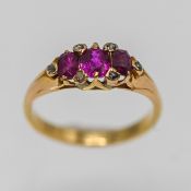 A Burma ruby and diamond set ring, in 18ct yellow gold, size K/L.