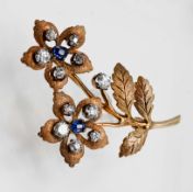 A sapphire and diamond double flower brooch, set in 9ct gold, marked 'D & F', approx 8.9g.