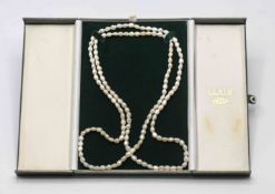 A long set of baroque pearls, length 56cm (no clasp) in Leath case.