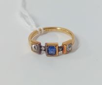 A diamond and sapphire three stone ring, set in 18ct yellow gold, size L/M.