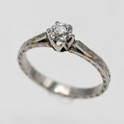 A platinum diamond set solitaire ring, size K.