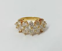 A diamond triple row ring, set in 18k yellow gold, size O/P.