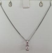 A 9ct white gold three piece set of jewellery including a 0.25ct diamond pendant and chain