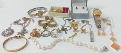 A small collection of costume jewellery including a Monet marked butterfly brooch, necklaces,