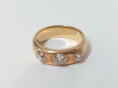 A yellow gold three stone diamond ring (unmarked), approx 8g, size P.