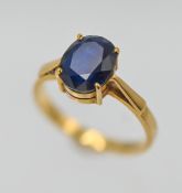 A sapphire single stone ring, centre oval brilliant cut Sapphire (Sri Lanka) with a dark hue, claw