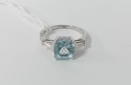A white gold aquamarine and diamond three stone ring, marked K18, D026, 861899, size N.