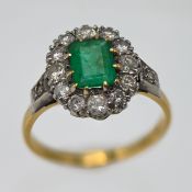 An 18ct yellow gold diamond and emerald cluster ring, approx 4.8g, size P