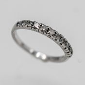 A platinum and diamond set half eternity ring, approx 3.3g, size M.