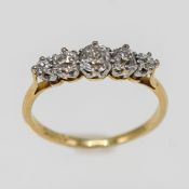A diamond five stone diamond ring, set in yellow gold (marked Plat), approx 2.2g, size L.