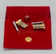 Cartier, a pair of gents cufflinks, marked Cartier 407591, Orectacier, with pouch.