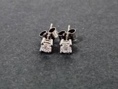 A pair of 18ct white gold diamond stud earrings (not marked).