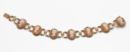 A 9ct gold bracelet set with seven cameos, length 19.5cm, approx 20.83g