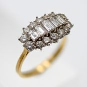 A large 18ct yellow gold and diamond cluster ring, set with five baguette cut diamonds in the