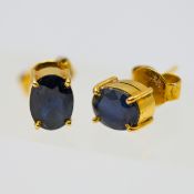A pair sapphire oval cut stud earrings, 2 x oval brilliant cut blue sapphires with dark hue (Sri