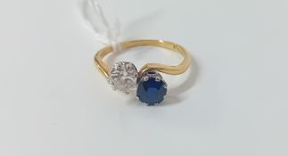 A sapphire and diamond 'twist' ring set in 18ct yellow gold, size P.