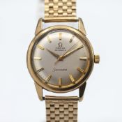 Omega, a gents automatic Seamaster wristwatch set in 9ct yellow gold, brick style bracelet, silver