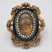 A large antique gold and seed pearl Mourning Brooch set with lockets of hair (not hallmarked),