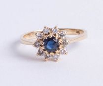 A 14ct (marked 585) sapphire and diamond cluster ring, approx 25 points, size J.