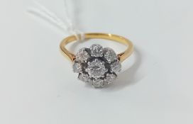 A yellow gold diamond set cluster ring (unmarked), size P.