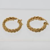 A pair of 14k yellow gold ornate hoop earrings, approx 3.11g