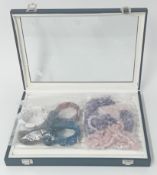 A ring display box, four Amethyst bracelets, two Rose Quartz long necklaces etc.