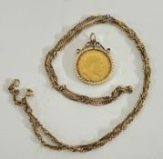 An Edward VII 1908 full gold sovereign, mounted and on a 9ct gold chain.