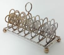 A Chinese silver six-section Toast Rack, the divisions pierced with ‘Good Luck’ character on ‘