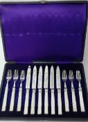 A Chinese silver six setting dessert service (knives and forks), in fitted box. Please see