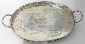 A Chinese silver oval Tray, the border gallery pierced bamboo leaves with two ‘bamboo’ handles,