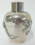 A Chinese silver ovoid lidded Tea Caddy with four toed dragons in high relief, engraved 'Presented