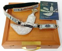 A middle eastern presentation Kanjar or Omani dagger, with silver mounted horn handle and sheaf