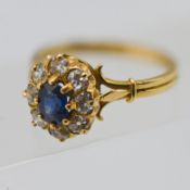 A sapphire and diamond set cluster ring, set in yellow gold, approx 3.7g, size O (not hallmarked).