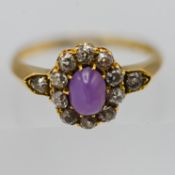 An Edwardian star ruby and diamond ring, set in 18ct yellow gold, size Q.