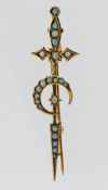 A gold opal set sword, crescent and star brooch, with rows of graduated, circular, cabochon opals,