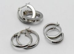 Three pairs of 9ct white gold hoop earrings. 5.2g,