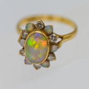 A diamond and opal cluster ring, set in 18ct yellow gold, approx 4.4g, size P/Q.