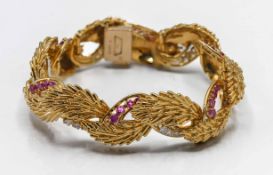 Kutchinsky, a fine 18ct diamond, ruby and gold bracelet, classic abstract straw spray design, signed