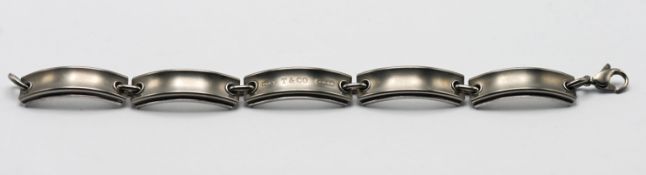 A Tiffany bracelet, comprising five long curved links, marked NYT&CO 1837, together with pouch.