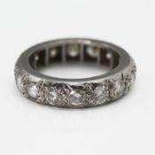 A full band diamond eternity ring, set with 16 round cut diamonds, 9.30g, size O/P,