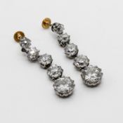 A good pair of diamond drop earrings each set with 5 graduated old brilliant transition cut stones